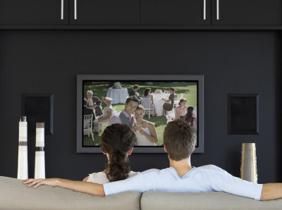 couple Watching TV on the sofa couple Watching TV on the sofa