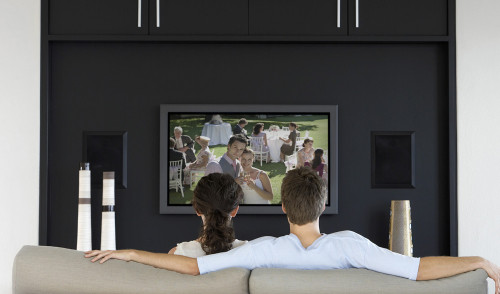 couple Watching TV on the sofa